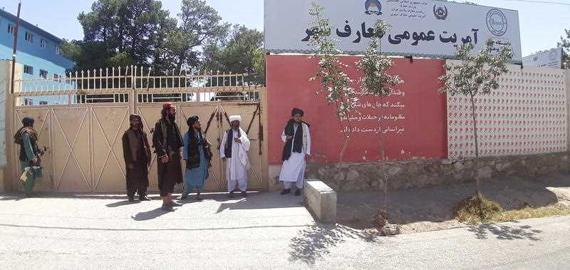 Taliban militants gather around a provincial government's office after taking control of Herat, Afghanistan, 13 August 2021