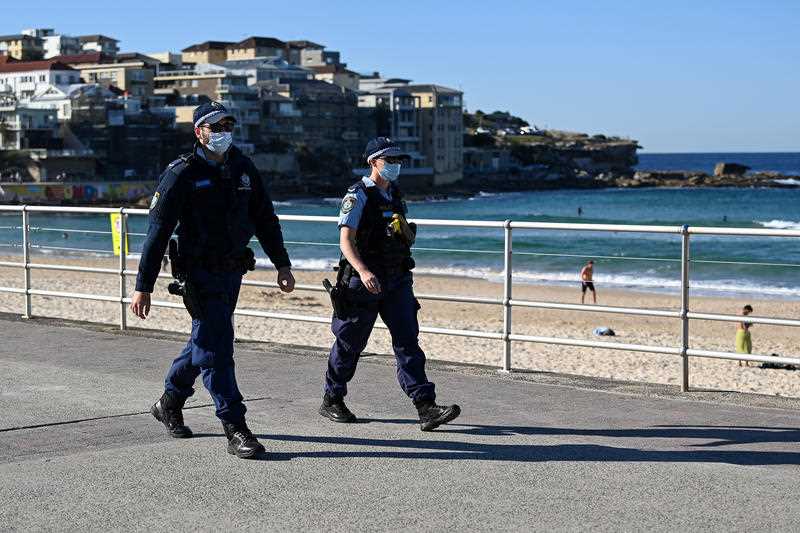 NSW Police officers patrol Bondi Beach in Sydney, Monday, August 16, 2021. All of NSW is under strict lockdown after a record number of COVID-19 cases that have authorities concerned for the healthcare system.