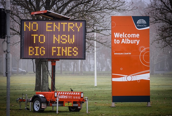 A sign is displayed regarding COVID-19 restrictions in the New South Wales (NSW), Victoria border town of Albury on July 7, 2020 in Australia.