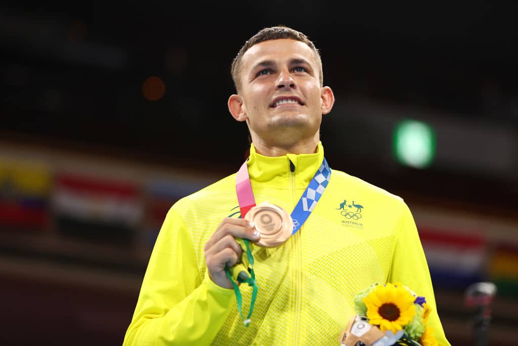 TOKYO, JAPAN - AUGUST 08: Harry Garside of Team Australia celebrates with his bronze medal during the victory ceremony for the Men's Light (57-63kg) Final on day sixteen of the Tokyo 2020 Olympic games at Kokugikan Arena on August 08, 2021 in Tokyo, Japan. (Photo by Buda Mendes/Getty Images)