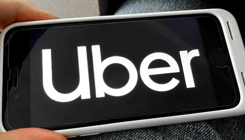uber logo and app photographed off an iphone