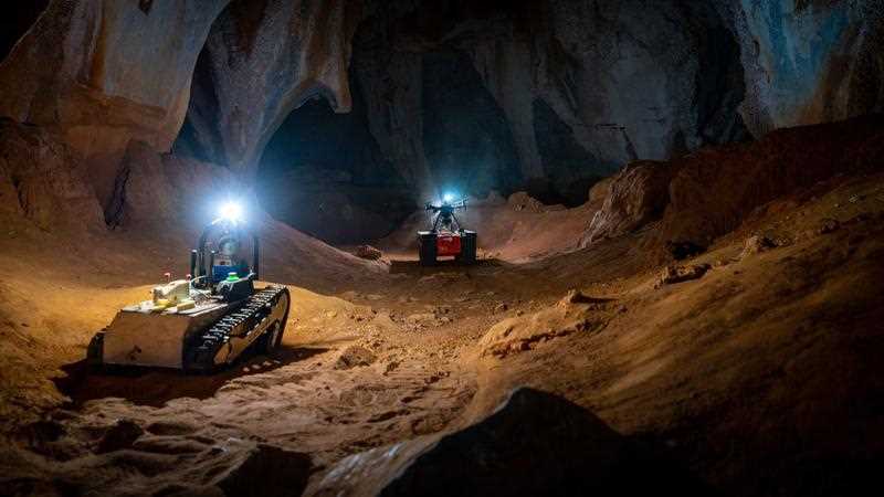 two CSIRO-developed robots are seen during a subterranean training session