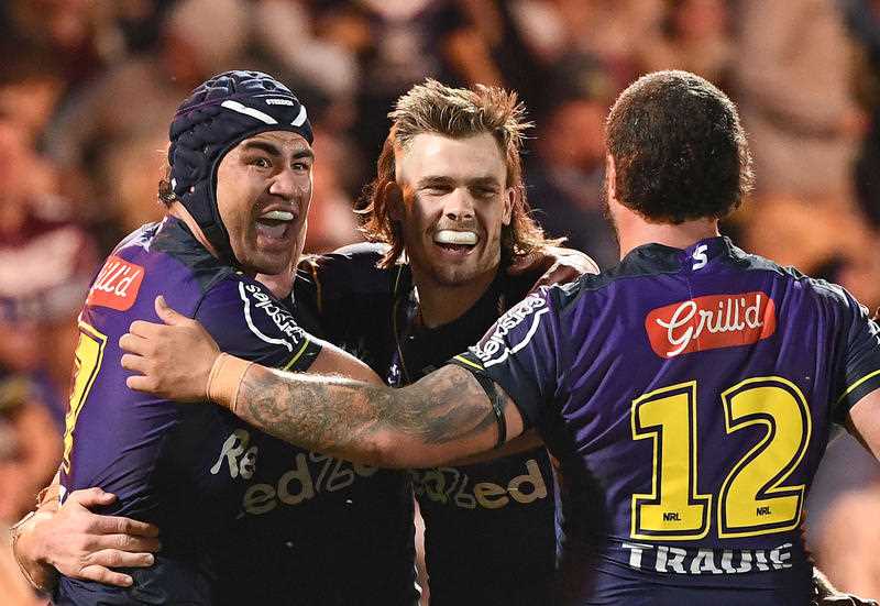Storm Ryan Papenhuyzen (C) celebrates after scoring a try during the NRL Qualifying Final match between the Melbourne Storm and the Manly Sea Eagles, at Sunshine Coast Stadium, on the Sunshine Coast, Friday, September 9, 2021
