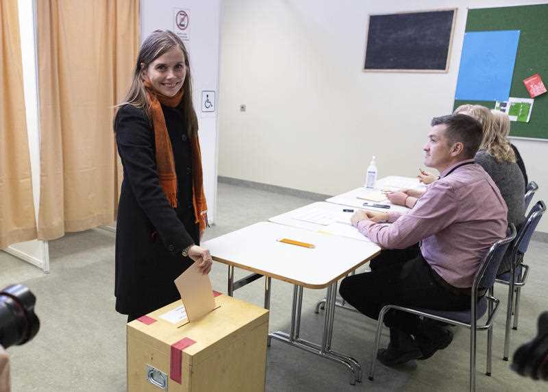 Iceland's Prime Minister Katrin Jakobsdottir casts her vote at a polling station in Reykjavik, Iceland, Saturday, Sept. 25, 2021
