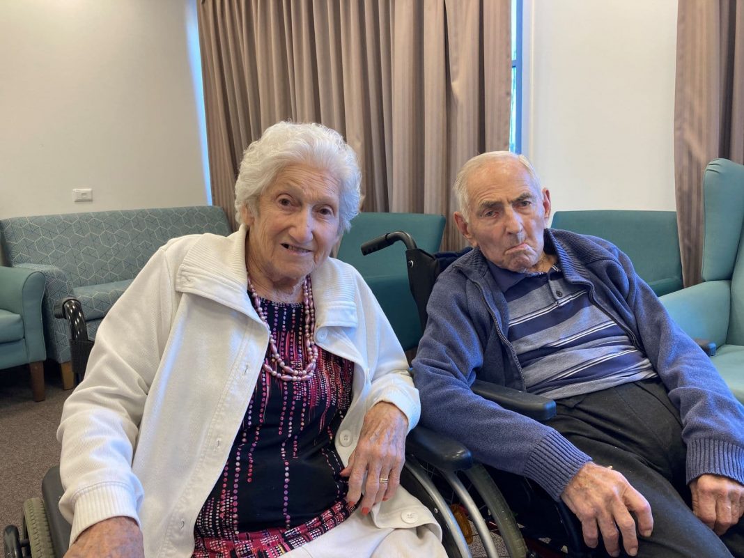 92-year-old woman and man in their wheelchairs at an aged care home