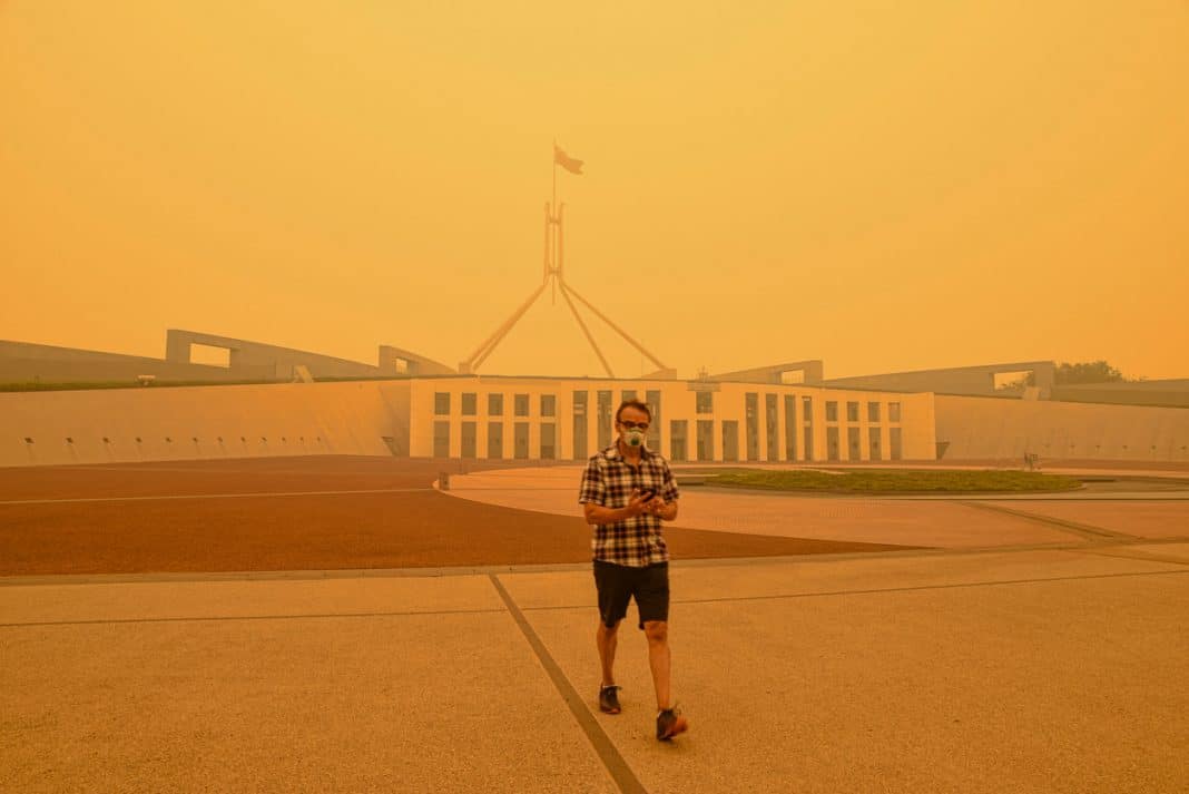 smoke haze is seen shrouding Australian Parliament House in Canberra during the 2019-20 Black Summer Bushfires