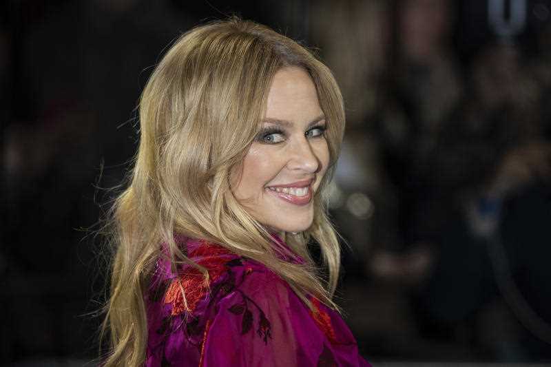 Australian singer Kylie Minogue poses for photographers in London in 2019