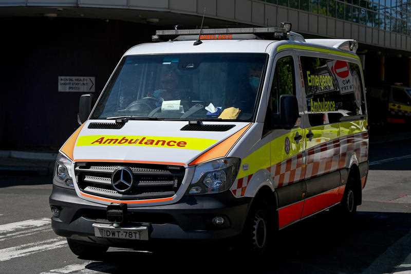 NSW Ambulances park in the receiving bay for the Emergency Department at a hospital