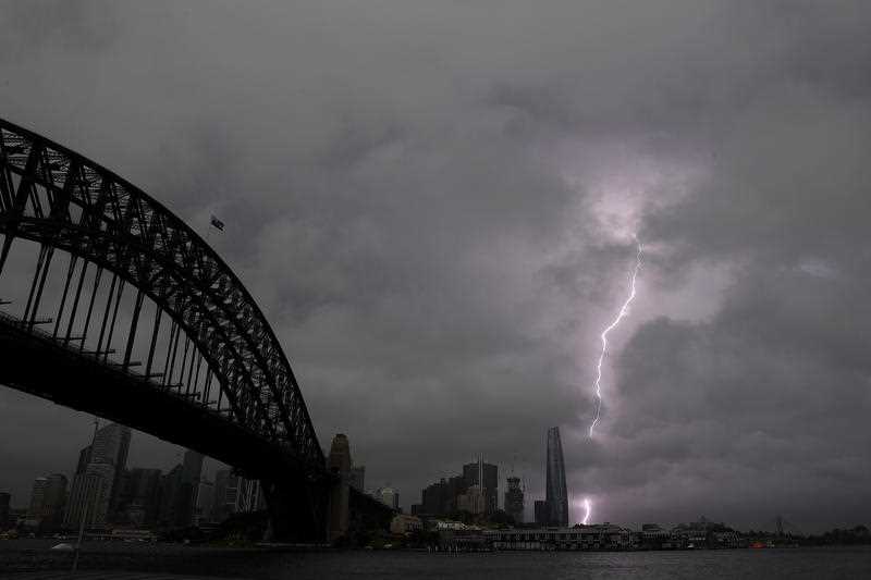 Storm clouds and lightning are seen in Sydney, Thursday, October 14, 2021