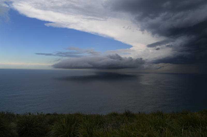 Storm cells are seen moving along the northern beaches of Wollongong in the Illawarra south of Sydne