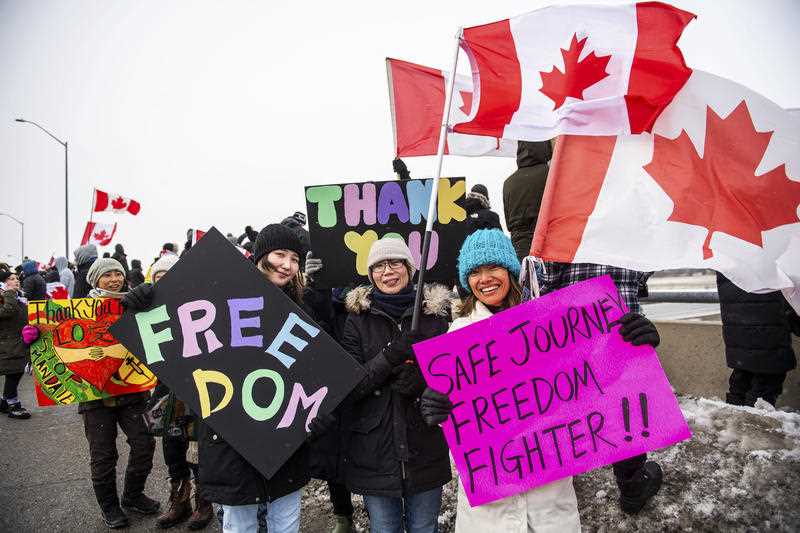 Protestors show their support for the Freedom Convoy of truck drivers who are making their way to Ottawa to protest against COVID-19 vaccine mandates by the Canadian government