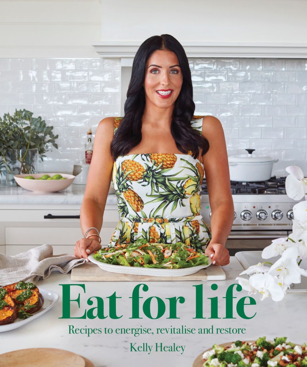 healthy smiling woman is seen on the cover of her 'Eat for Life' recipe book