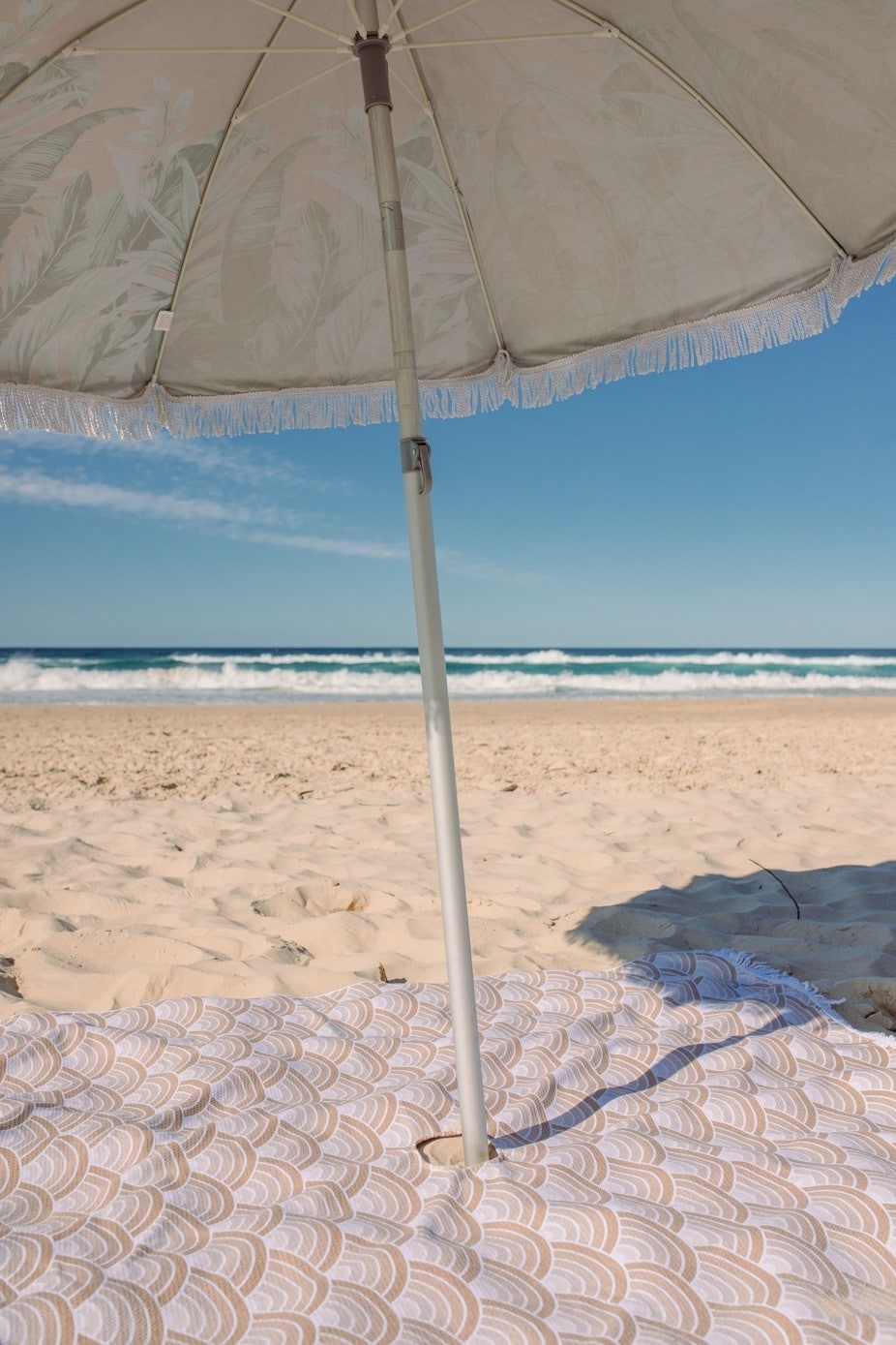 beach towel and beach umbrella at the seaside