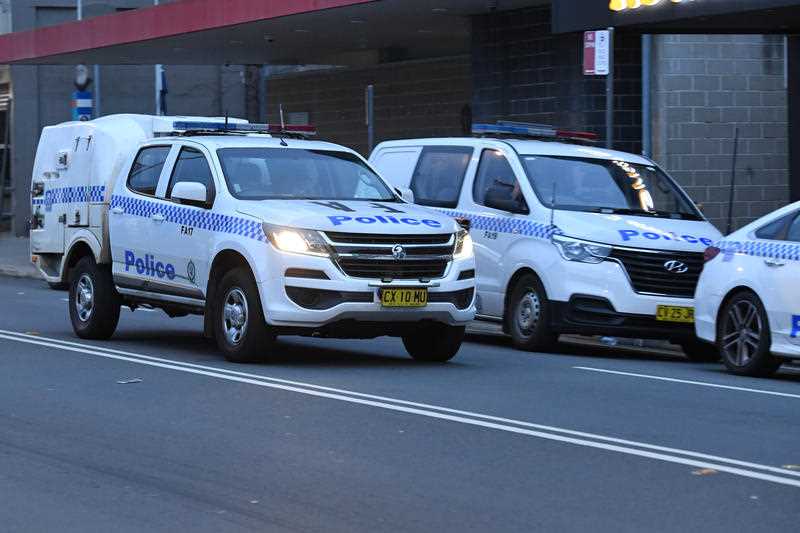 Several NSW Police cars are seen outside a police station