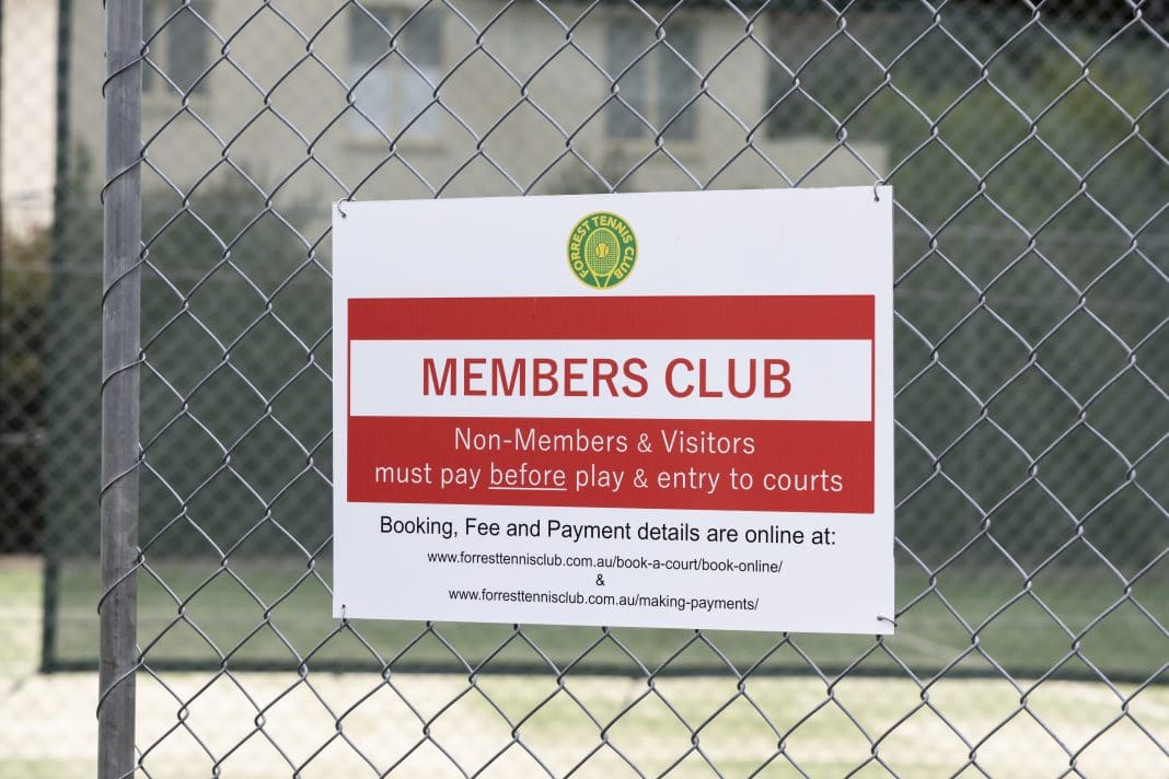 Signage on wire fence at Forrest Tennis Club in Canberra