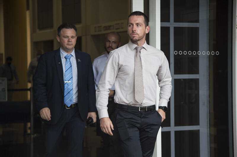 Zachary Rolfe (right) leaving the Supreme Court of the Northern Territory, in Darwin, Thursday, February 24, 2022.