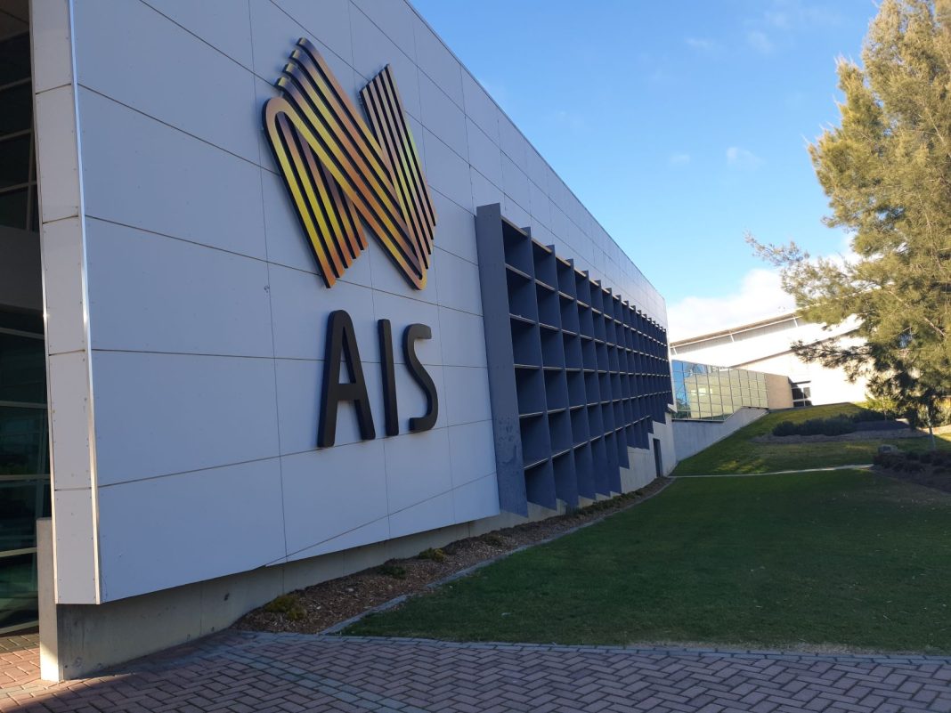 AIS signage is seen on the exterior of an Australian Institute of Sport building in Canberra