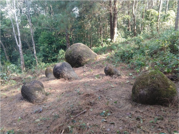 several ancient giant stone jars seen in the earth in Assam, India