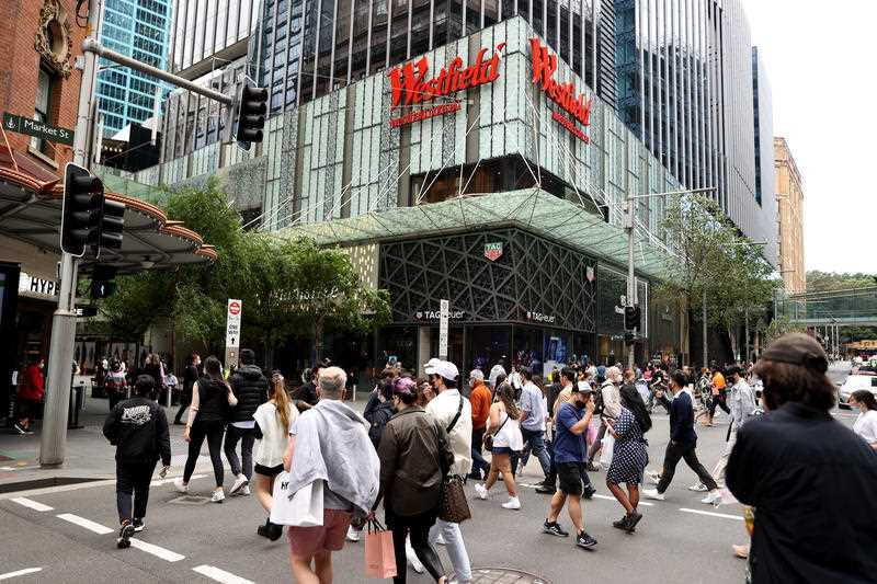 Shoppers walk around Pitt Street Mall in Sydney,