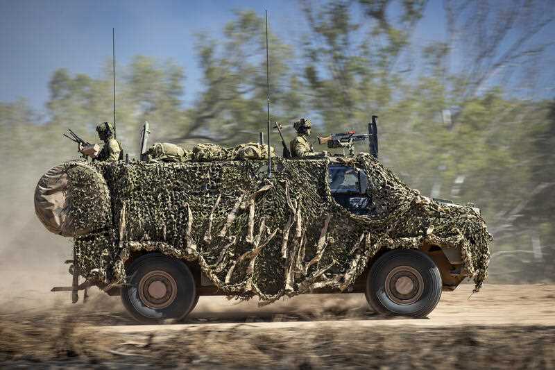 an Australian Army Bushmaster armored vehicle moves off road during a training mission July 7, 2021, Townsville