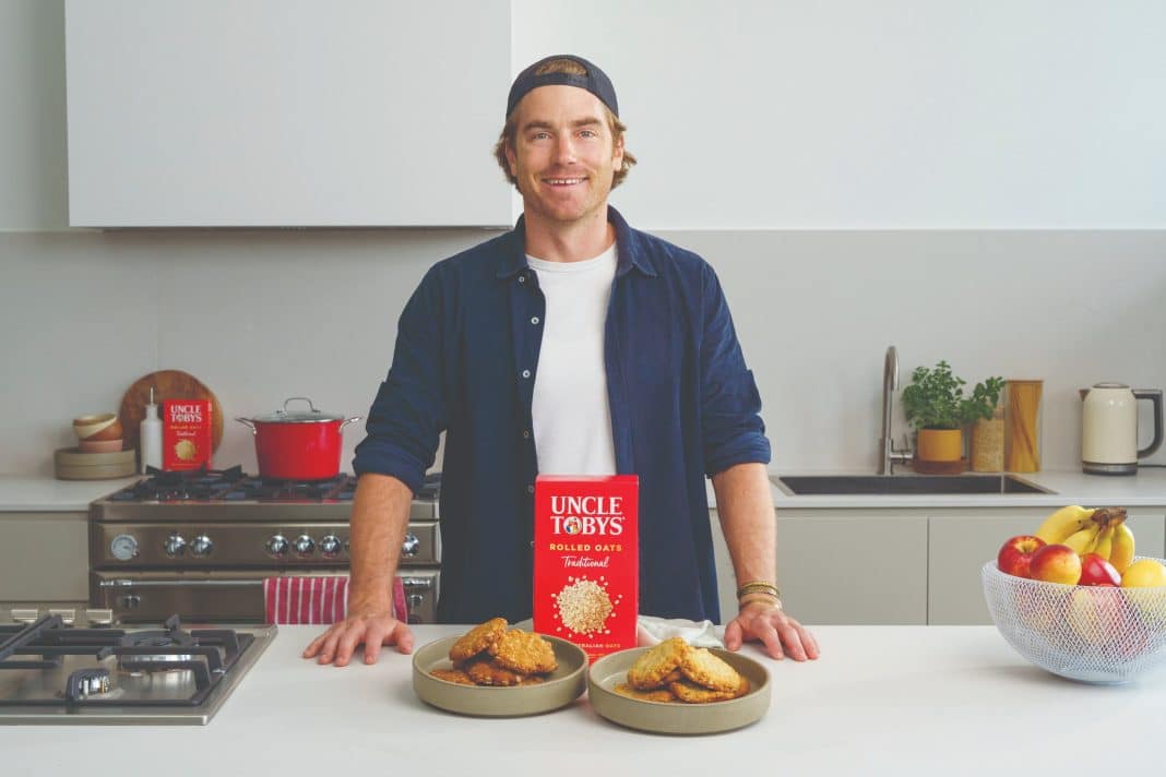 MasterChef and Taste of Australia’s Hayden Quinn with Anzac biscuits and pack of Uncle Tobys oats