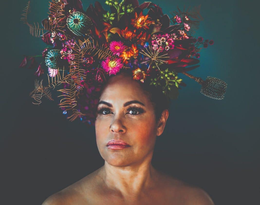 beautiful Award-winning Indigenous Australian singer Christine Anu wearing a floral headpiece