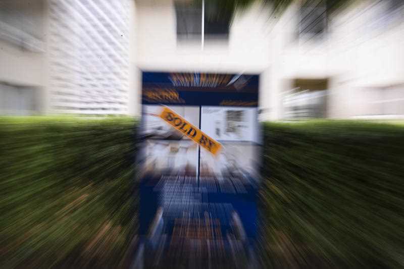 A ’SOLD’ sign is seen outside an apartment block in Canberra