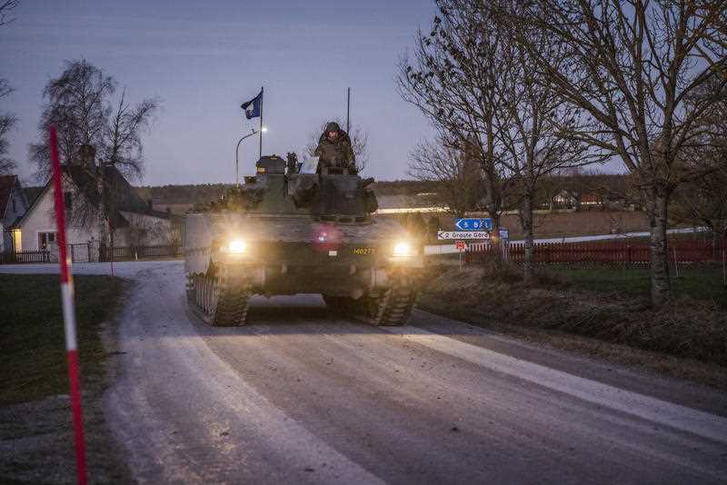 Members of Gotland's Regiment patrol in a tank, on a road in Visby, northern Gotland, Sweden