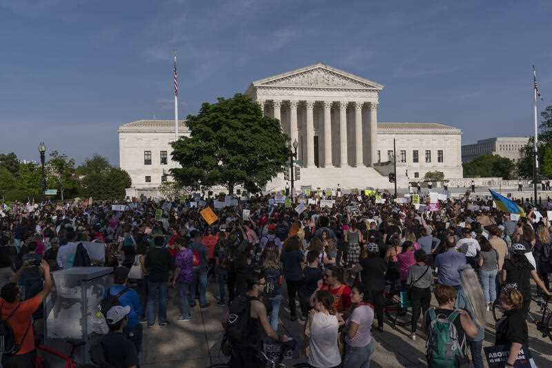 Demonstrators protest outside of the U.S. Supreme Court Tuesday, May 3, 2022 in Washington.