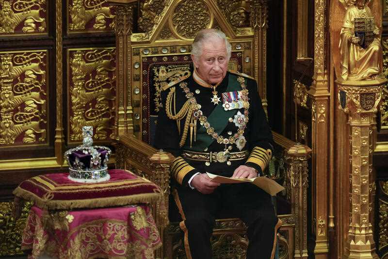 Prince Charles reads the Queen's speech next to her crown during the State Opening of Parliament, at the Palace of Westminster in London, Tuesday, May 10, 2022