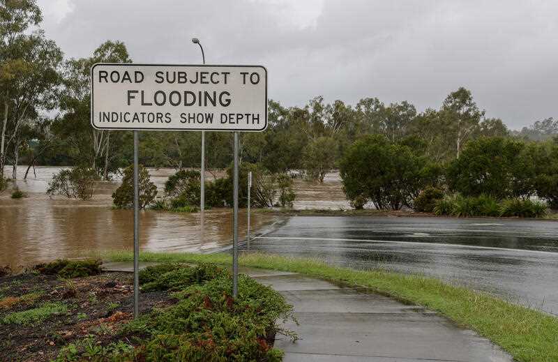 The Bremer River is seen flooding roads and ovals near Old Toowoomba Road in Ipswich, Friday, May 13, 2022