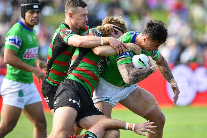 Charnze Nicoll-Klokstad of the Raiders (right) in action during the NRL Round 11 match between the South Sydney Rabbitohs and the Canberra Raiders at Apex Oval in Dubbo, Sunday, May 22, 2022.