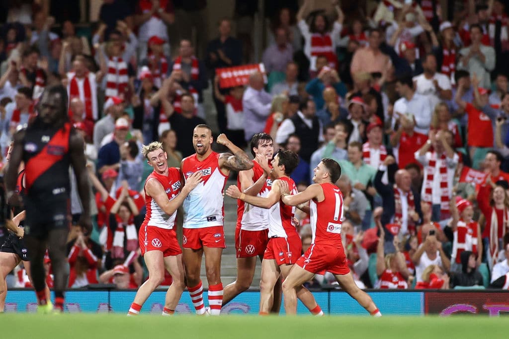 SYDNEY, AUSTRALIA - APRIL 08: Lance Franklin of the Swans celebrates kicking a goal with team mates during the round four AFL match between the Sydney Swans and the Essendon Bombers at Sydney Cricket Ground on April 08, 2021 in Sydney, Australia. (Photo by Cameron Spencer/Getty Images)