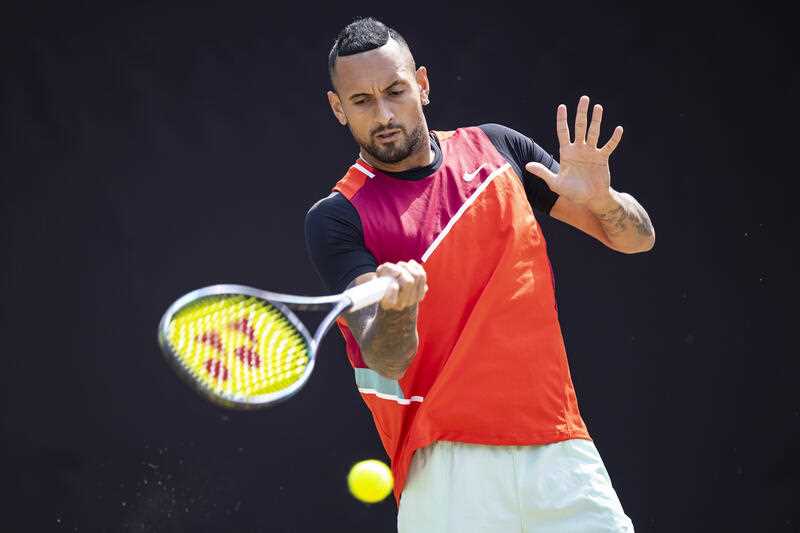 Australia's Nick Kyrgios returns a ball to Britain's Andy Murray during their ATP tennis semifinals match in Stuttgart, Germany, Saturday, June 11, 2022.