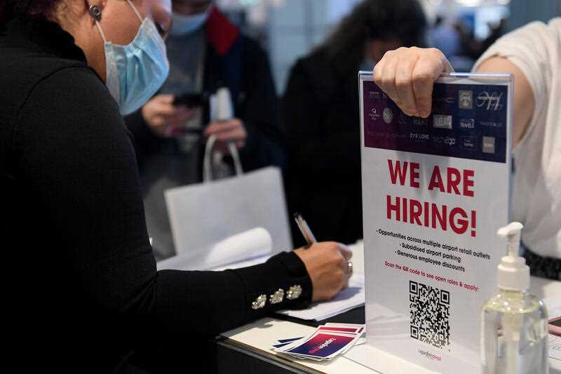 ‘We are hiring’ signage is seen during a Sydney Airport and partners jobs fair at Sydney Airport in Sydney, Thursday, June 16, 2022.