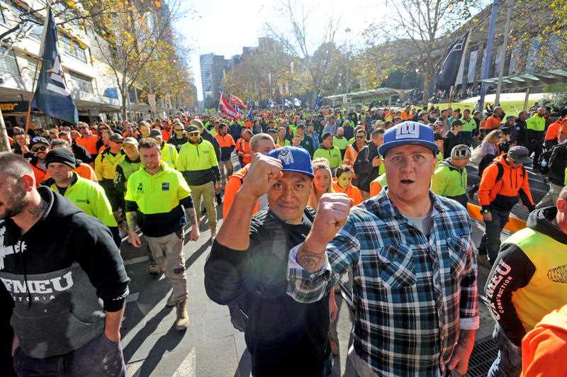Building and construction workers march during a rally in Melbourne in June 2017
