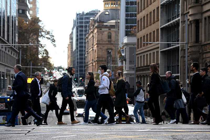 People are seen in the central business district (CBD) of Sydney