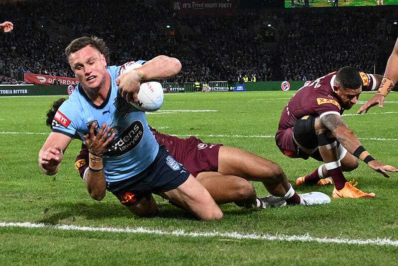Jack Wighton of the Blues scores a try during Game 1 of the 2022 State of Origin series between the New South Wales Blues and the Queensland Maroons at Accor Stadium in Sydney, Wednesday, June 8, 2022