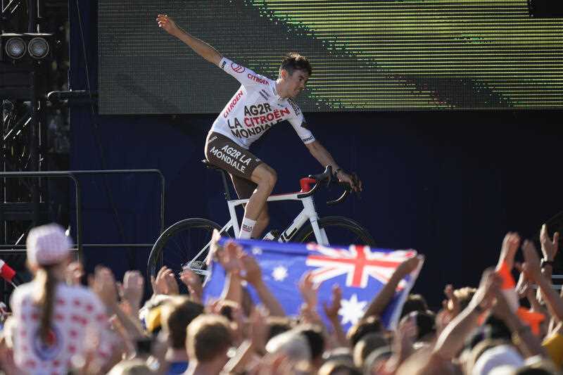Australia's Ben O'Connor greets fans during the team presentation ahead of the Tour de France cycling race in Copenhagen, Denmark, Wednesday, June 29, 2022