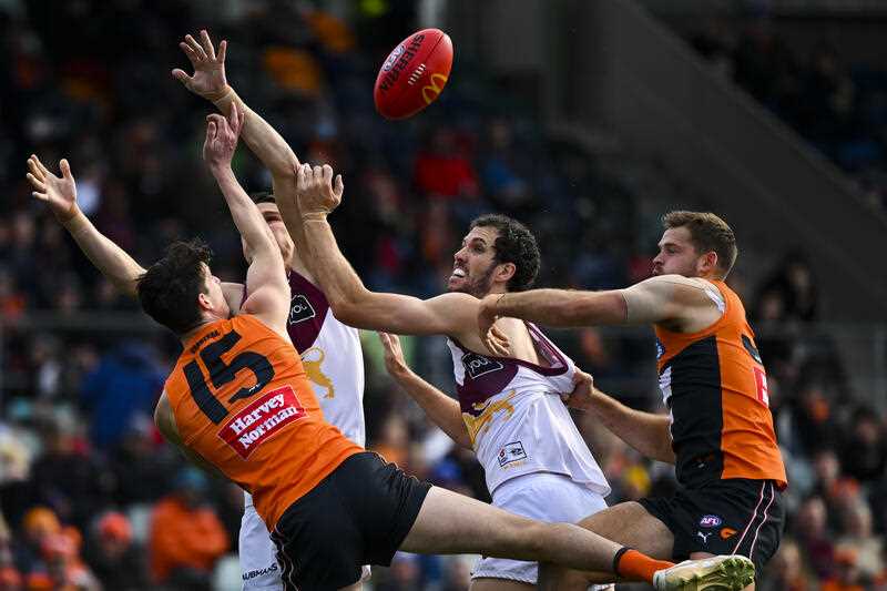 Sam Taylor of the Giants attempts to take a mark during the AFL Round 18 match between the GWS Giants and the Brisbane Lions at Manuka Oval in Canberra, Saturday, July 16, 2022.