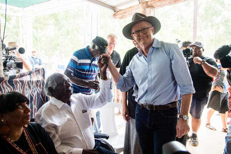 Prime Minister Anthony Albanese shakes hands with Yothu Yindi Foundation chair Galarrwuy Yunupingu after delivering a speech to Indigenous leaders, campaigners and advocates gathered at the Garma Festival in northeast Arnhem Land