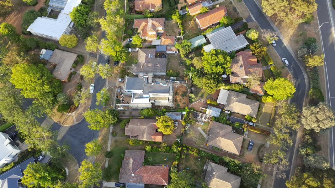 Aerial view of new house under construction in established Inner South Canberra suburb