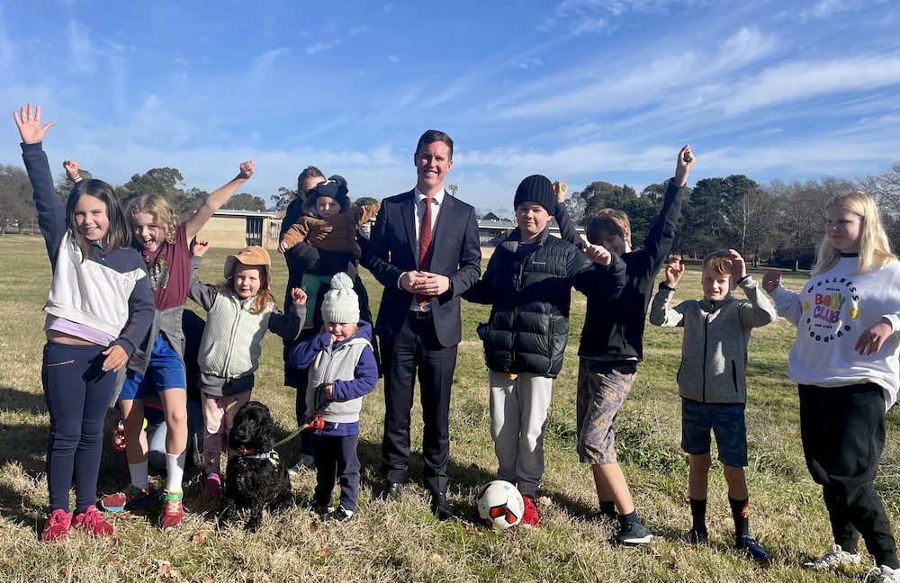 Minister Chris Steel and friends look forward to a new playground in Watson. Photo: ACT Government.