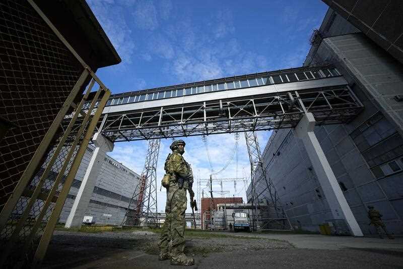 A Russian serviceman guards an area of the Zaporizhzhia Nuclear Power Station in territory under Russian military control, southeastern Ukraine