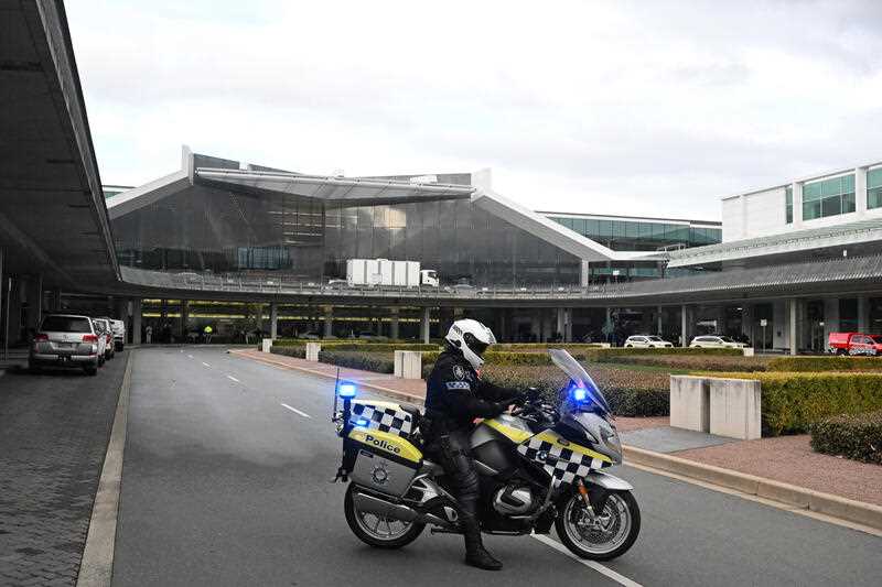 Australian Federal Police are seen after a shooting where a man fired at least 3 shots from a pistol at Canberra Airport in Canberra, Sunday, August 14, 2022.