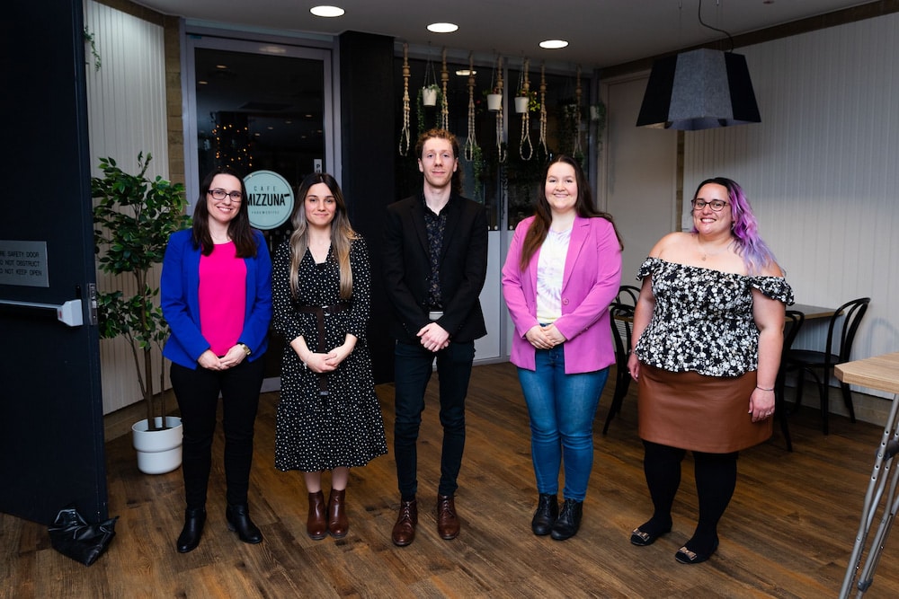 David Hinwood (centre) with Natalie Downes, Elena Gorgeva, J J Bull, and Cara Doherty, competitors in the University of Canberra’s Three Minute Thesis. Photo: Tyler Cherry