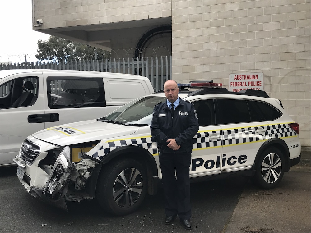 Chief Police Officer Neil Gaughan and rammed police vehicles. Photo: Nick Fuller