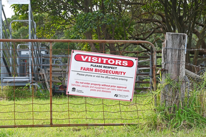 Bio-security sign on a farm gate with visitors please respect farm bio-security