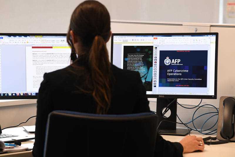 An employee works at a computer terminal in the Australian Centre to Counter Child Exploitation in Brisbane