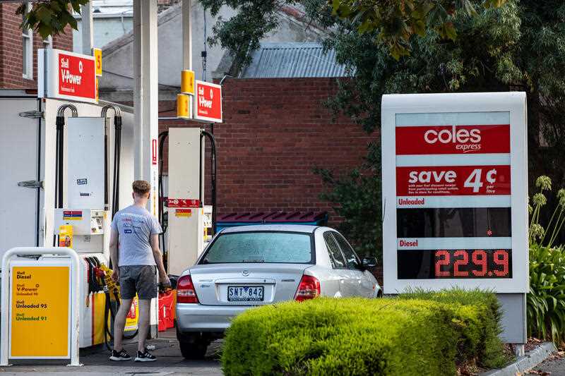 Fuel prices are listed on a fuel price board at a Coles petrol station